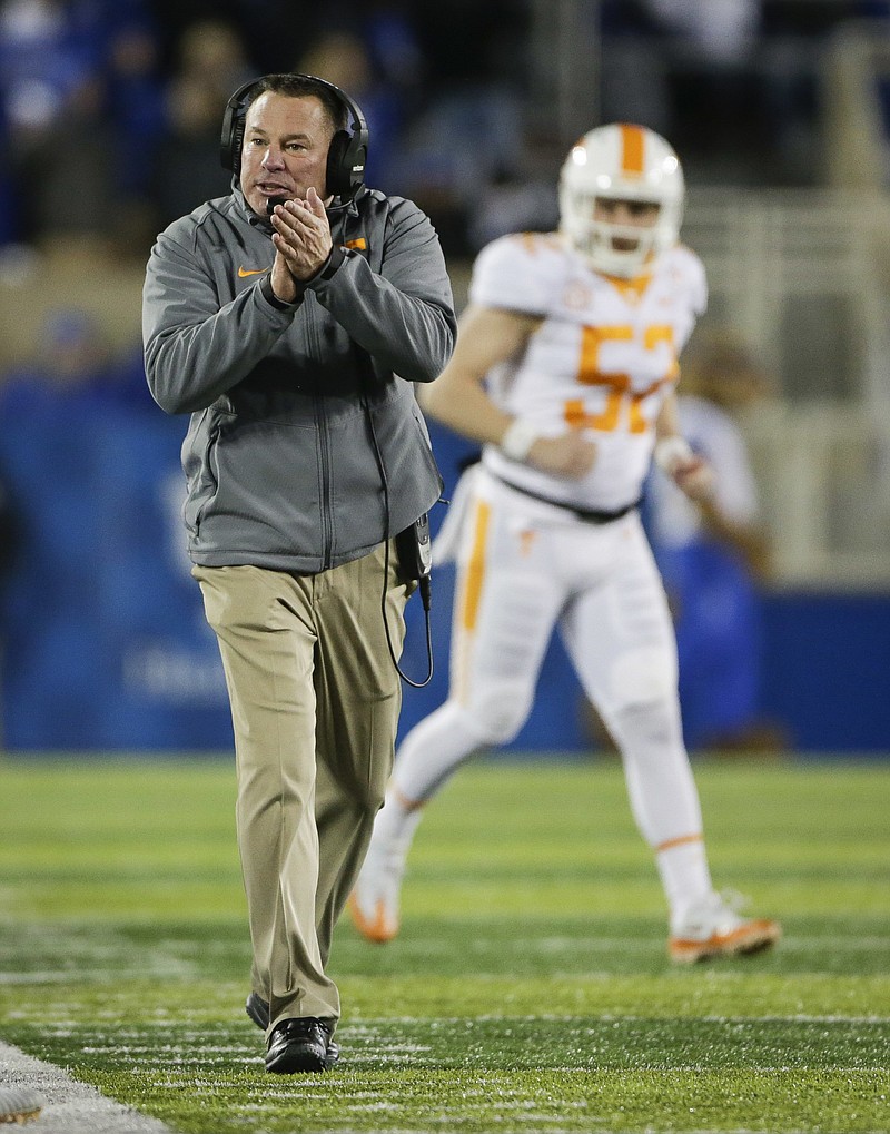 Tennessee head coach Butch Jones encourages his team during the second half of an NCAA college football game against Kentucky Saturday, Oct. 28, 2017, in Lexington, Ky. Kentucky won the game 29-26. (AP Photo/David Stephenson)