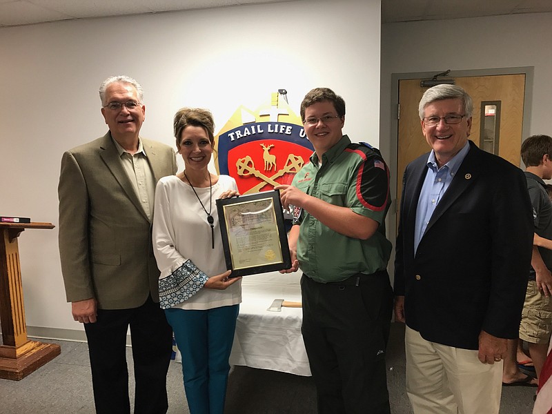 Nathan Chamberlain, third from left, is honored by Morris Hill Baptist Church pastor Bill Mason, District 7 Hamilton County Commissioner Sabrena Smedley and state Sen. Todd Gardenhire, from left, for receiving the Freedom Award, which recognizes the highest level of achievement in Trail Life USA.(Contributed photo)