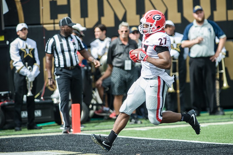 Georgia senior tailback Nick Chubb, shown here scoring a touchdown last month at Vanderbilt, has helped the Bulldogs reach No. 1 in the college football playoff standings.