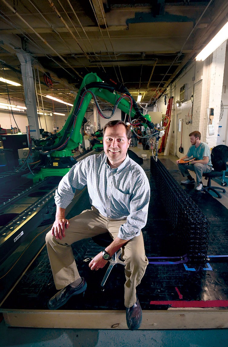 Branch Technology CEO Platt Boyd sits in front of the world's largest freeform 3D printer inside the INCubator on Chattanooga's North Shore.