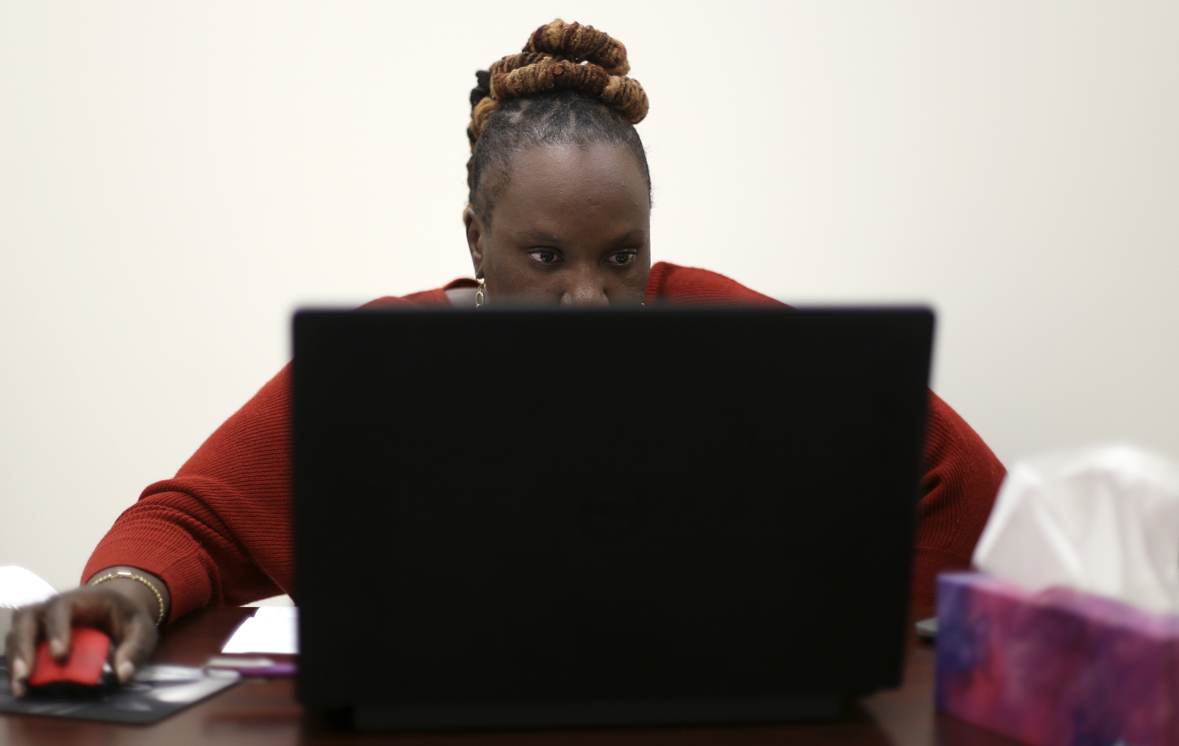 Katherlyn Geter, the Get Covered Tennessee navigator for the Chattanooga area, works on her computer while she meets with the Times Free Press to discuss the Affordable Care Act enrollment process at Mount Canaan Baptist Church on Wednesday, Nov. 1, 2017 in Chattanooga, Tenn.