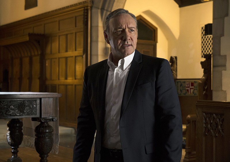 This image released by Netflix shows Kevin Spacey in a scene from "House Of Cards." Netflix says it's suspending production on "House of Cards" following harassment allegations against Spacey. (David Giesbrecht/Netflix via AP)