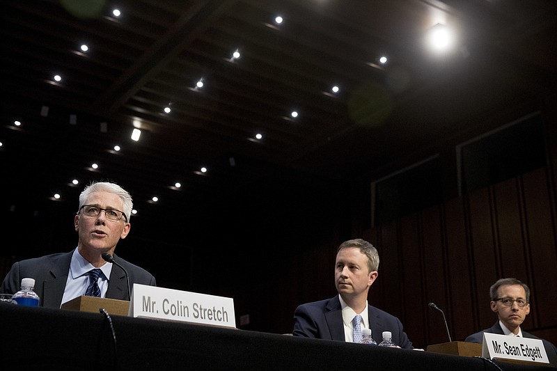 From left, Facebook's General Counsel Colin Stretch, accompanied by Twitter's Acting General Counsel Sean Edgett, and Google's Law Enforcement and Information Security Director Richard Salgado, speaks during a Senate Committee on the Judiciary, Subcommittee on Crime and Terrorism hearing on Capitol Hill in Washington, Tuesday, Oct. 31, 2017, on more signs from tech companies of Russian election activity. (AP Photo/Andrew Harnik)
