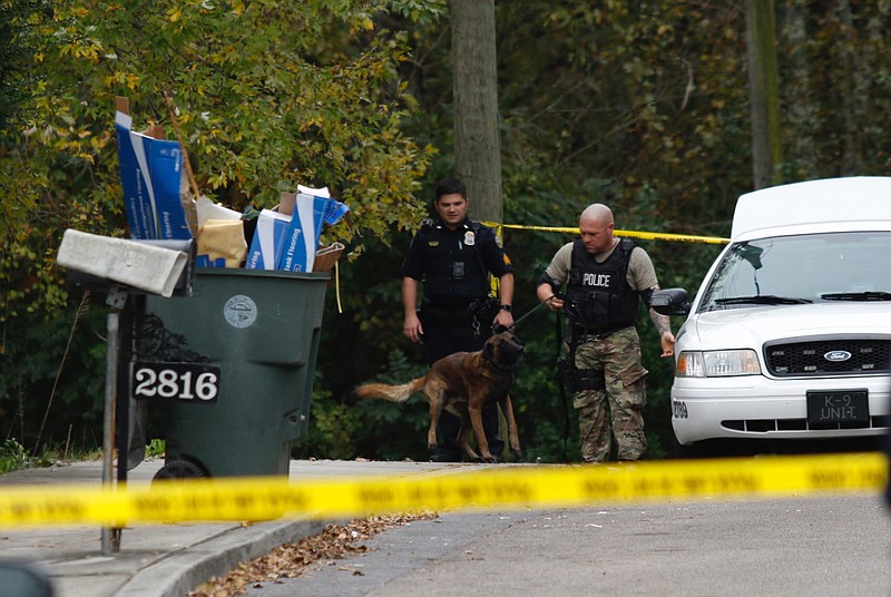 Chattanooga Police use a canine unit while investigating a shooting in the 2800 block of Cannon Avenue on Wednesday, Nov. 1, 2017.