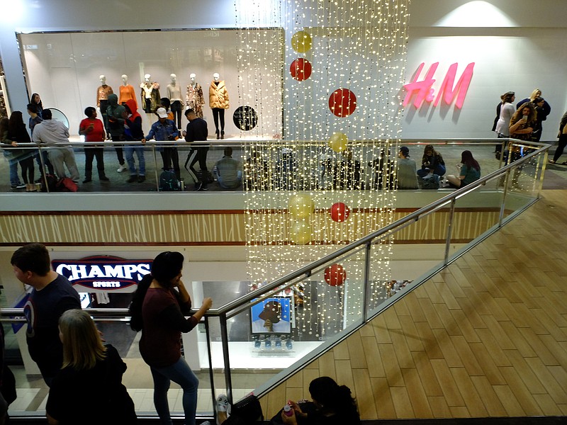 Inside Hamilton Place Mall, shoppers line the walkway Thursday morning in prior to the opening of H&M, CBL's newest tenant at Chattanooga's largest shopping mall.