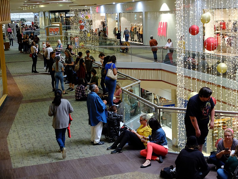 Inside Hamilton Place Mall, shoppers line the walkway Thursday morning in prior to the opening of H&M, CBL's newest tenant at Chattanooga's largest shopping mall.