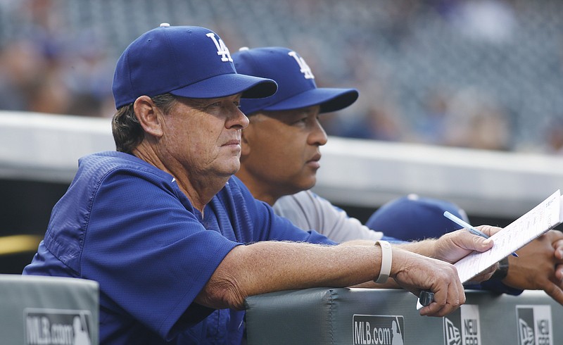 Los Angeles Dodgers pitching coach Rick Honeycutt, left, and manager Dave Roberts watch a game against the Colorado Rockies in Denver during the 2016 season. Honeycutt is a Chattanooga native who starred at Lakeview High School in Fort Oglethorpe, Ga., before going on to the University of Tennessee.