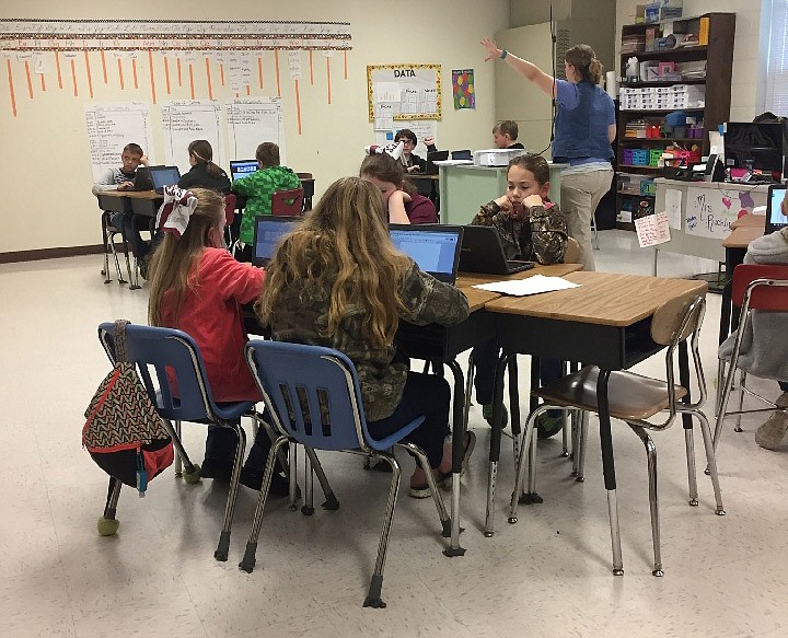 Fifth-grade students in Jessica Ruehling's RLA class at Coalmont Elementary School work on essays "What I am Thankful For" on the recently purchased Google Chromebooks with Title I funding. According to Principal Russell Ladd, the advanced technology provides fourth and fifth graders with access to Google Classroom and an opportunity to prepare for future online state assessment testing.