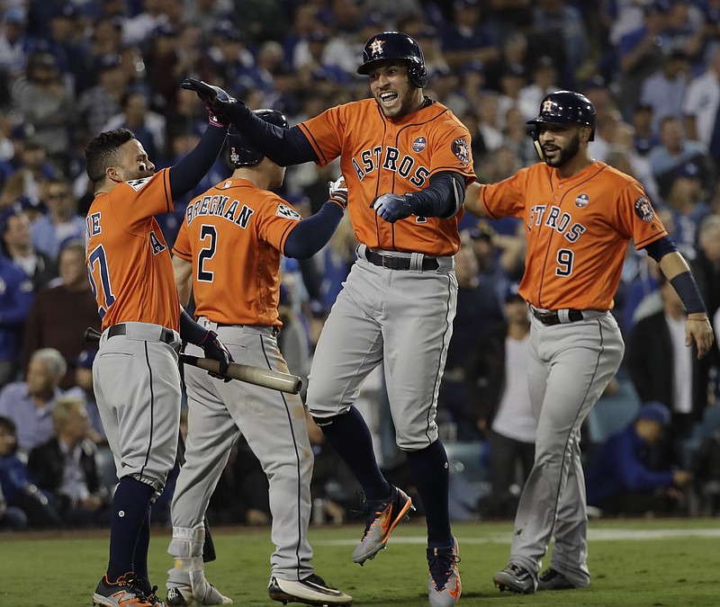 Houston Astros' George Springer reacts after hitting a two-run home run during the second inning of Game 7 of baseball's World Series against the Los Angeles Dodgers Wednesday, Nov. 1, 2017, in Los Angeles. (AP Photo/David J. Phillip)