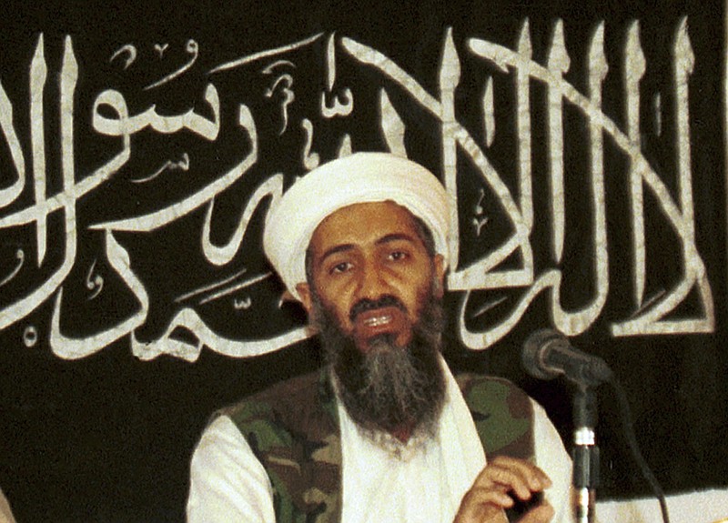 In this 1998 file photo made available on March 19, 2004, Osama bin Laden is seen at a news conference in Khost, Afghanistan. The CIA's release of documents seized during the 2011 raid that killed al-Qaida leader Osama bin Laden has again raised questions about Iran's support of the extremist network leading up to the Sept. 11 terror attacks. U.S. intelligence officials and prosecutors have long said Iran formed loose ties to the terror organization from 1991 on, something noted in a 19-page report in Arabic included in the release of some 47,000 other documents by the CIA. Iran always has denied any links. (AP Photo/Mazhar Ali Khan, File)