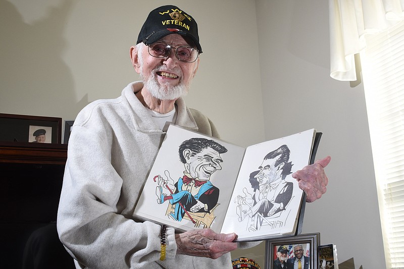 Vernon Herod, 90, displays a sketch book of his art showing President Ronald Reagan and Richard Nixon from inside his apartment in Collegedale.