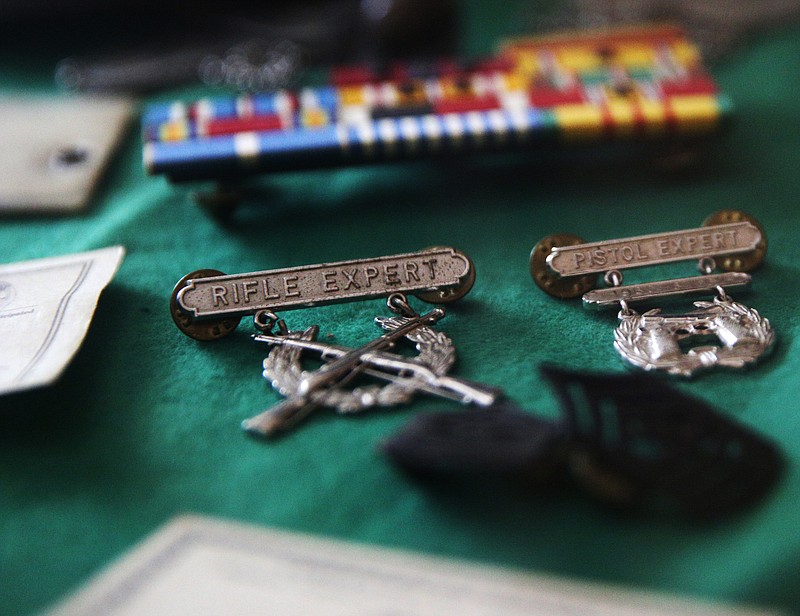 Several of Sgt. Major Hank Clark's ribbons and medals are on display in a case Thursday, Oct. 26, 2017, in his room at Hickory Valley Retirement Community in Chattanooga, Tenn. Clark fudged his age to join the Military before he was actually old enough. 