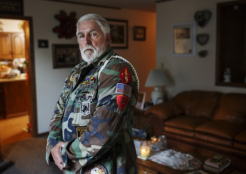 Vietnam veteran Larry Johnson poses for a portrait in his home on Tuesday, Oct. 31, 2017, in Chattanooga, Tenn. Johnson volunteered for the United States Marine Corps and served as a rifleman in an outpost near Danang from 1967-1968, where he was shot in the leg while defending a bunker.