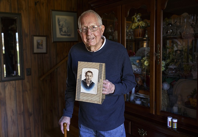 World War II veteran George Dagley poses for a portrait in his home on Tuesday, Oct. 31, 2017, in Pikeville, Tenn. Dagley volunteered for the U.S. Navy and served as a signal man in a merchant marine armed guard unit aboard the S.S. Ovid Butler in the western Pacific from 1944-1946.