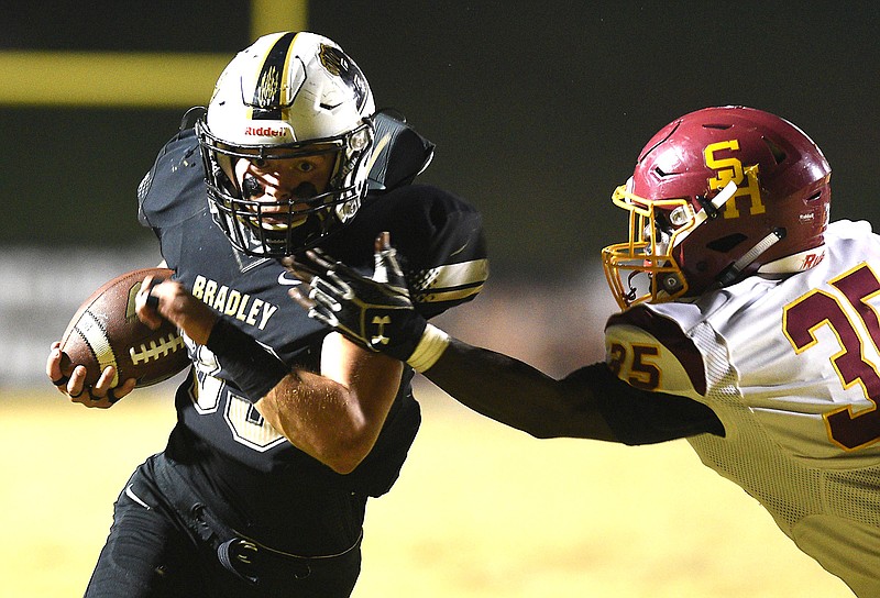 Bradley's Adam Mullis (33) gets past Science Hill's Arthur James (35)  for the Bears's first touchdown.  The Science Hill Hilltoppers visited the Bradley Central Bears in the first round of the TSSAA football playoffs on November 3, 2017. 