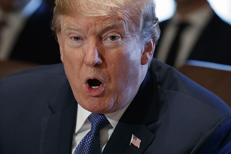 In this Nov. 1, 2017 photo, President Donald Trump speaks during a cabinet meeting at the White House in Washington. Trump on Thursday backed away from his threat to send the suspect in the New York bike path attack to Guantanamo Bay, acknowledging in an early morning tweet that the military judicial process at the Cuban detention center takes longer than the civilian federal court system. But Trump called again for the man to be executed. (AP Photo/Evan Vucci)