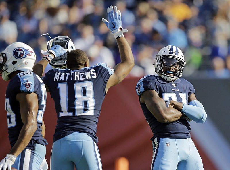 Tennessee Titans wide receiver Rishard Matthews (18) celebrates with free safety Kevin Byard (31) after Byard made his second pass interception of the game against the Baltimore Ravens in the second half of an NFL football game Sunday, Nov. 5, 2017, in Nashville, Tenn. (AP Photo/James Kenney)