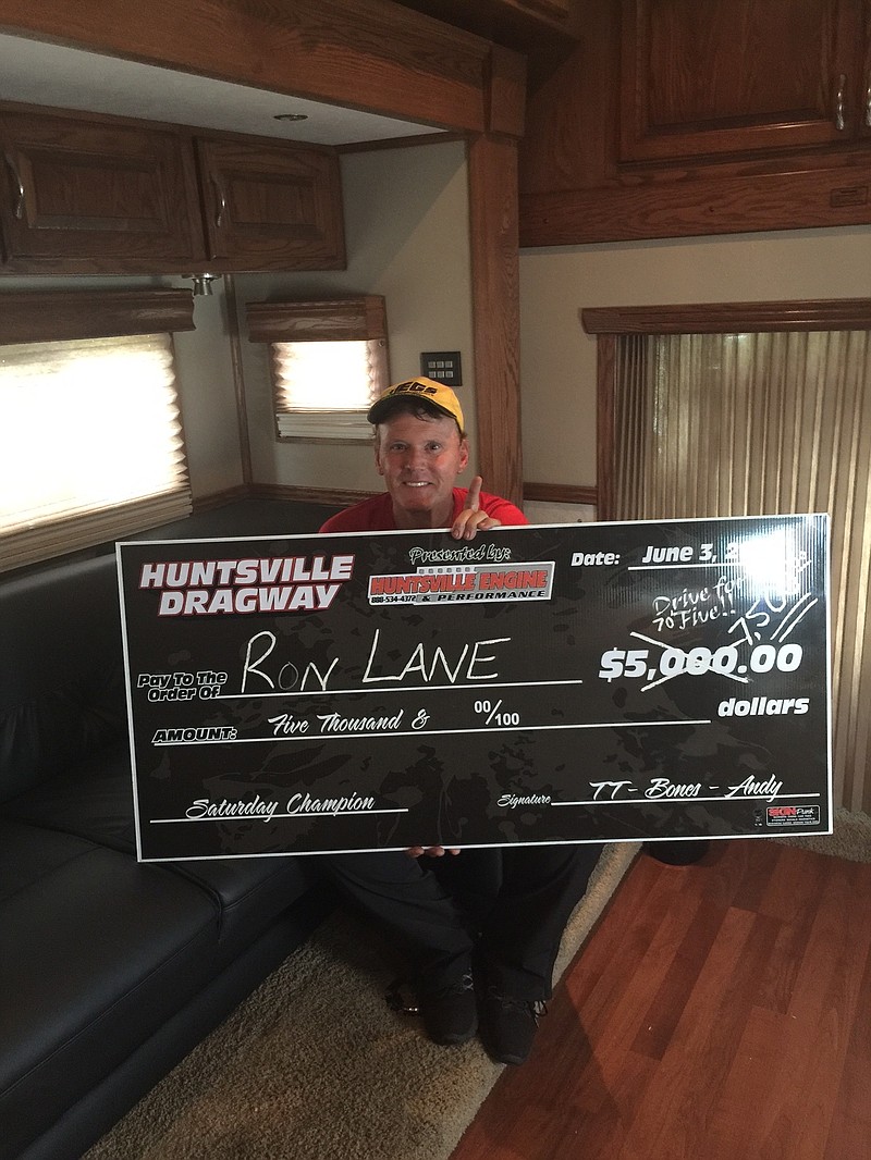 Hixson resident Ron Lane holds the facsimile check for the $7,500 he won at a Huntsville, Ala., drag strip this past weekend.