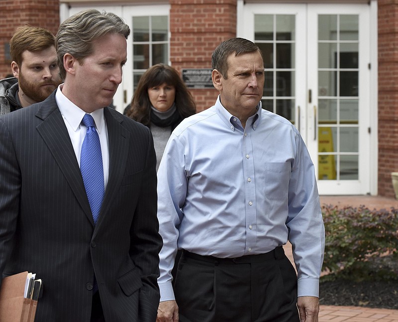 In this Feb. 9, 2016, file photo, Pilot Flying J vice president of direct sales Scott Wombold, right, leaves federal court after being arraigned in Knoxville, Tenn. Four former executives, including former Pilot Flying J President Mark Hazelwood, and ex-vice president Wombold, go on trial in Chattanooga on Monday, Nov. 6, 2017. (Michael Patrick /Knoxville News Sentinel via AP, File)