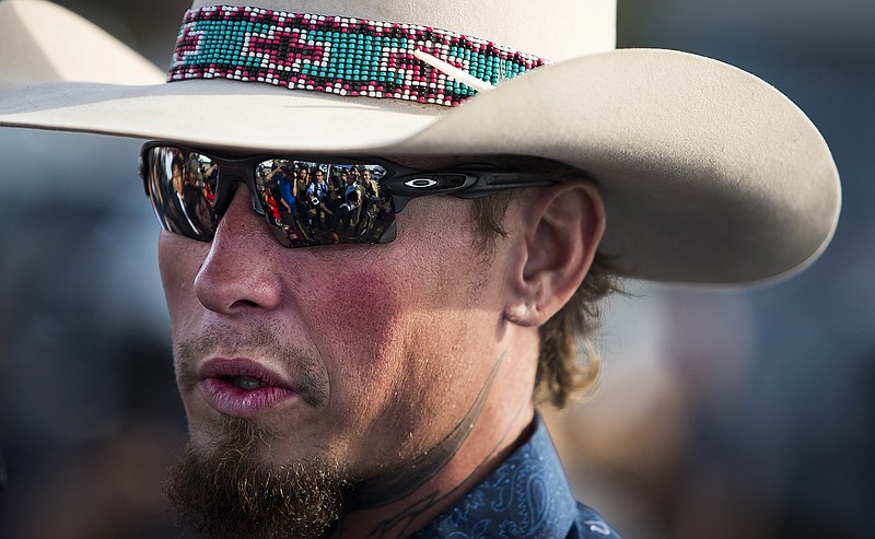 Johnnie Langendorff speaks to reporters about the mass shooting at the First Baptist Church in Sutherland Springs, Texas, on Monday, Nov. 6, 2017. Langendorff says he and another man chased down the gunman after he fled the church where he killed more than 20 people. (Nick Wagner/Austin American-Statesman via AP)