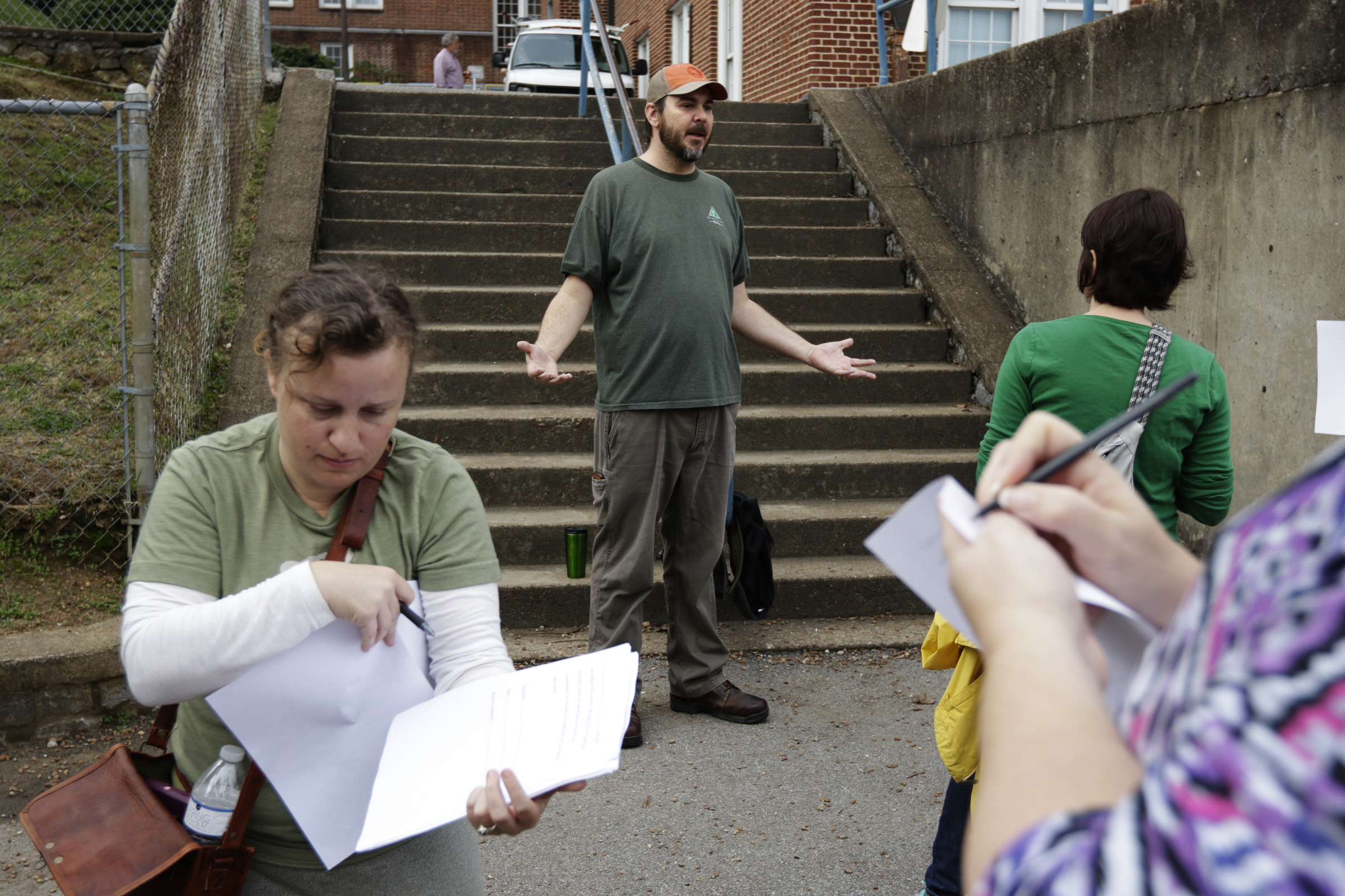 Robert Parks gives instructions to volunteers before a search for missing CSAS 2nd grade teacher John Eaton beginning in the school's parking lot on Tuesday, Nov. 7, 2017, in Chattanooga, Tenn. Volunteers searched Eaton's typical route from Sequoyah Access Road along U.S. Highway 27, Tennessee Highway 153, DuPont Parkway, and Amnicola Highway to the school. Eaton left home on Sunday for the school but never returned.