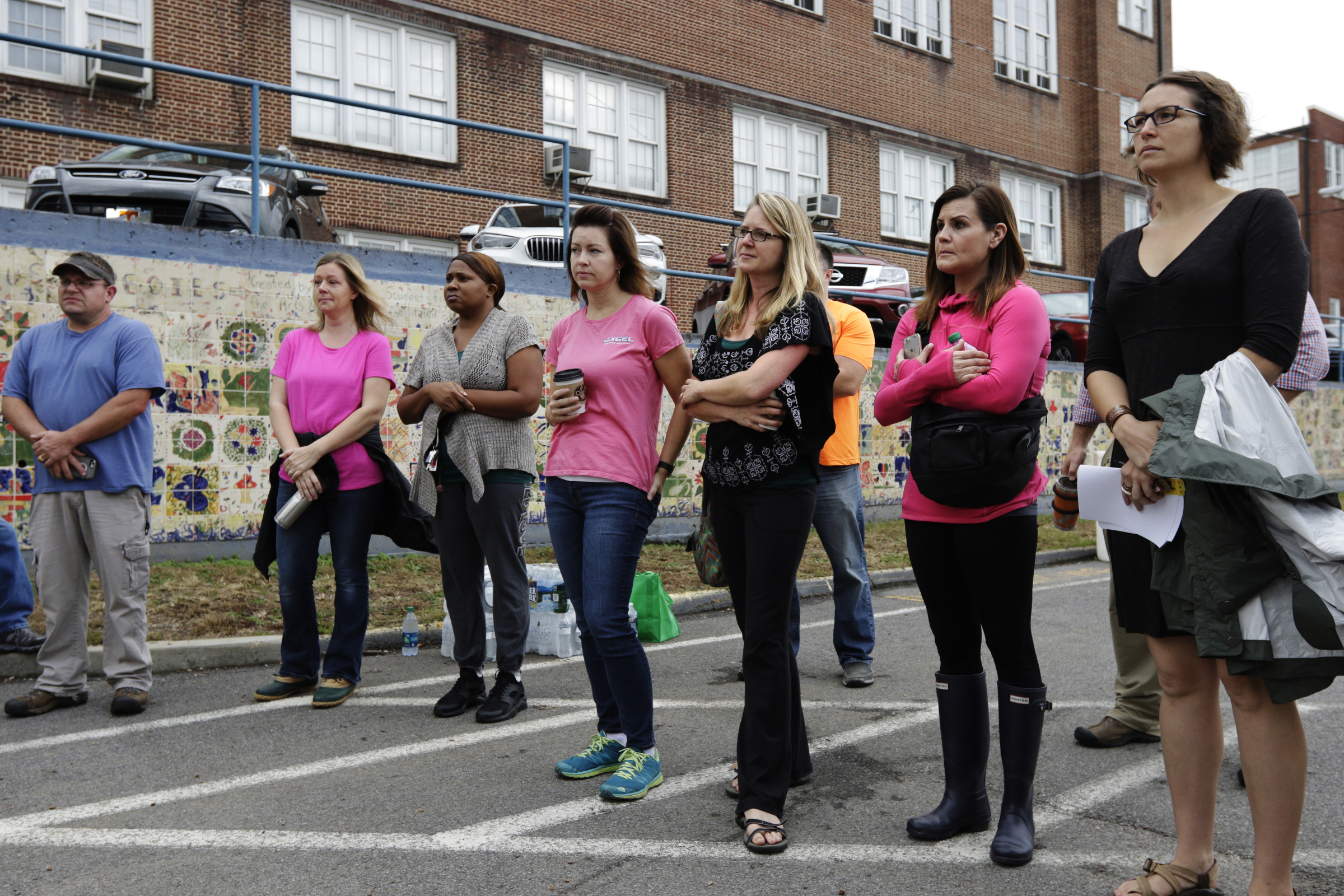 Volunteers listen to instructions in the CSAS parking lot before a search for missing 2nd grade teacher John Eaton on Tuesday, Nov. 7, 2017, in Chattanooga, Tenn. Eaton left home on Sunday for the school but never returned. Volunteers searched Eaton's typical route from Sequoyah Access Road along U.S. Highway 27, Tennessee Highway 153, DuPont Parkway, and Amnicola Highway to the school.