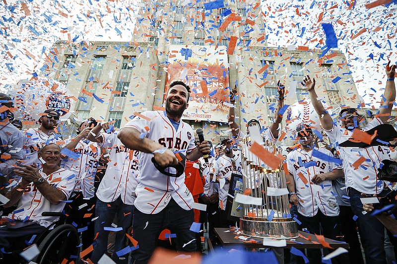 Houston Astros' Jose Altuve, center, and his teammates celebrate during a rally honoring the World Series baseball champions Friday, Nov. 3, 2017, in Houston. (Brett Coomer/Houston Chronicle via AP)