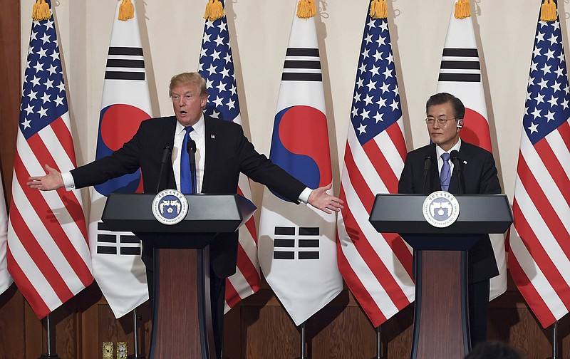 U.S. President Donald Trump, left, speaks as South Korean President Moon Jae-In listens during a joint press conference at the presidential Blue House in Seoul, South Korea, Tuesday, Nov. 7, 2017. (Jung Yeon-Je/Pool Photo via AP)