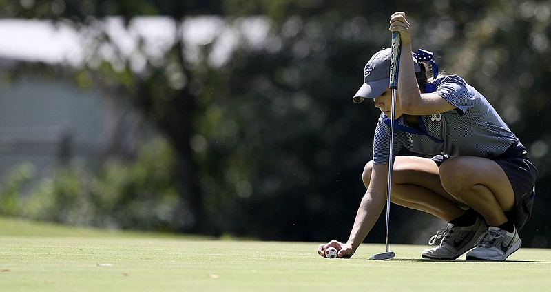 Rheagan Hall lines up a putt while competing for Cleveland High School during the district tournament in September at Cleveland Country Club. Hall signed with UTC's golf program on Wednesday.