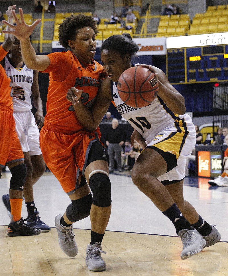 Mercer guard Kahlia Lawrence, left, guards UTC's Queen Alford during a game at McKenzie Arena in February. Lawrence, a two-time SoCon player of the year, is back for her senior season.