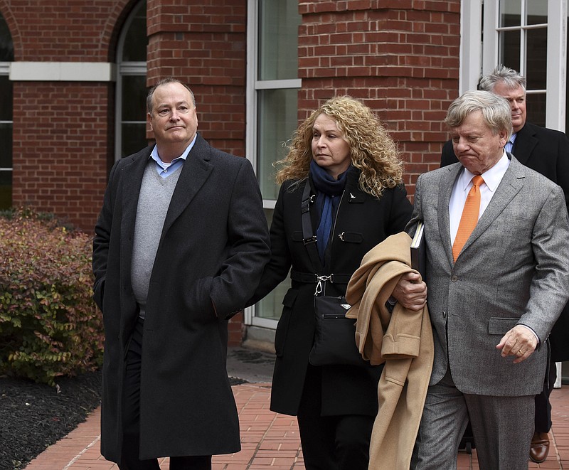  In a Tuesday, Feb. 9, 2016, file photo, former Pilot Flying J President Mark Hazelwood, left, leaves federal court after being arraigned, in Knoxville, Tenn. Four former executives, including former Pilot Flying J President Hazelwood, and ex-vice president Scott Wombold, go on trial in Chattanooga on Monday, Nov. 6, 2017. (Michael Patrick /Knoxville News Sentinel via AP)