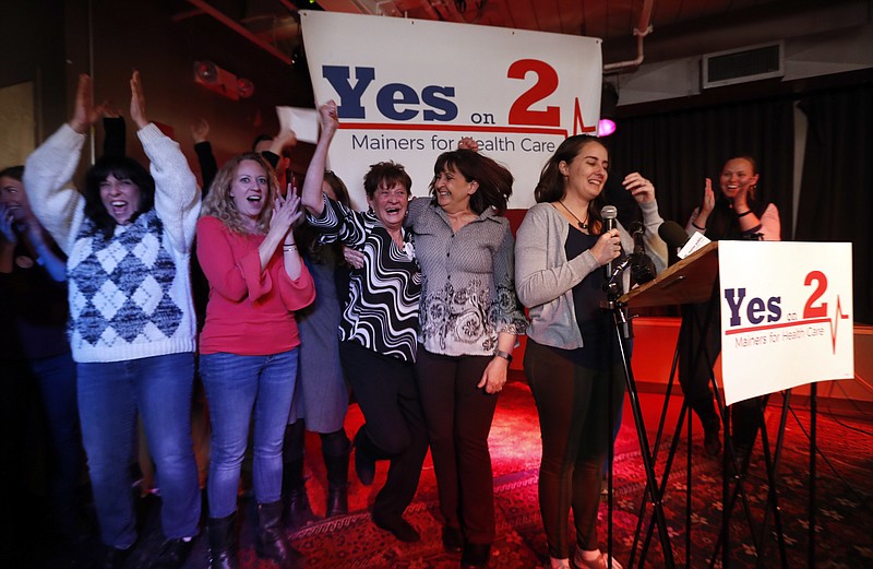 Supporters of Medicaid expansion celebrate their victory, Tuesday, Nov. 7, 2017, in Portland, Maine. Maine voters say they want to join 31 other states in expanding Medicaid under the Affordable Care Act, the signature health bill of former President Barack Obama. (AP Photo/Robert F. Bukaty)