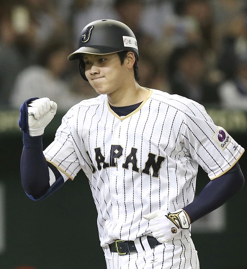 
              FILE - In this Nov. 12, 2016, file photo, Japan's designated hitter Shohei Otani reacts after hitting a solo home run off Netherlands' starter Jair Jurrjens in the fifth inning of their international exhibition series baseball game at Tokyo Dome in Tokyo. Texas, the New York Yankees and Minnesota can pay the most to an international free agent as highly touted pitcher-outfielder Shohei Otani prepares to enter the market, and Major League Baseball and its Japanese counterpart have agreed to the outlines of a deal to keep the old posting system for this offseason. (AP Photo/Koji Sasahara, File)
            