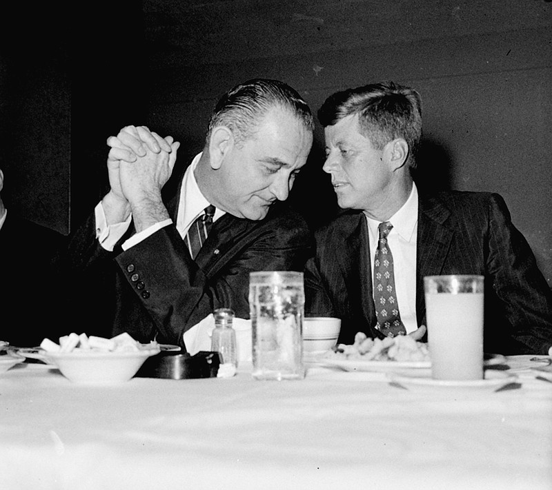 Then-vice presidential nominee Lyndon Johnson, left, confers with presidential nominee John F. Kennedy in 1960.