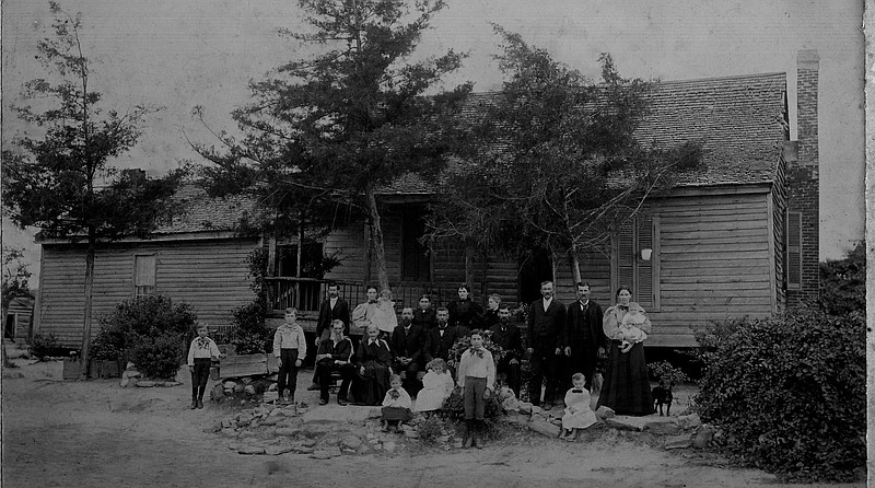 In 1838 and 1840, Elijah and Minerva Thurman (seated at the far left) acquired a number of tracts of land in what is now St.Elmo and immediately across the Georgia state line. The couple is pictured in this undated photograph with their children and grandchildren in front of their home, "Ashland." Shortly before his death in1873, Elijah deeded one acre of his property for a family cemetery.
