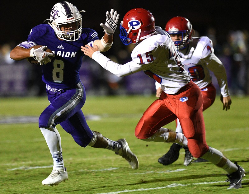 Marion County senior Jacob Saylors (8) fights off a tackle attempt by Polk County's Connor Barks during their Region 3-2A matchup to close the regular season Oct. 27 in Jasper, Tenn. Saylors has racked up thousands of yards and dozens of touchdowns and lots interceptions in four seasons as a starter for the Warriors.