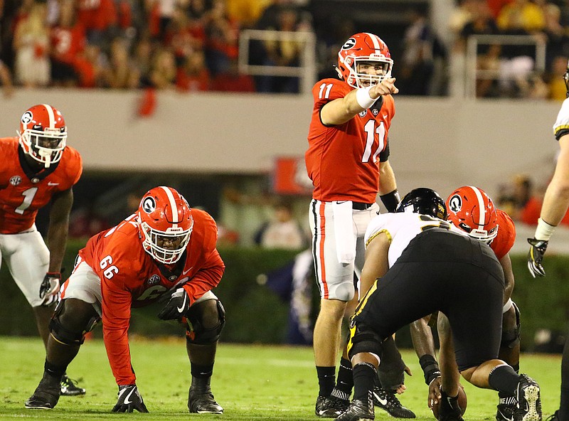 Georgia freshman quarterback Jake Fromm points to the Missouri defense last month before beginning a play that has an option to run or throw the ball.