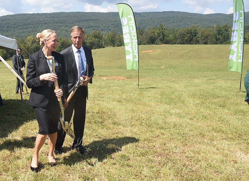 Tennessee Governor Bill Haslam, right, walks and talks with Nokian Tyres CEO Hille Korhonen Wednesday in Rhea County.