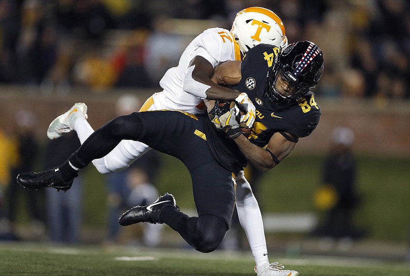 Missouri wide receiver Emanuel Hall falls into the end zone after catching a pass for a touchdown as Tennessee defensive back Emmanuel Moseley tries to stop him in the first half of the host Tigers' 50-17 victory.