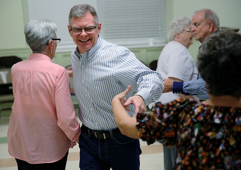 Jerome Gordon, who went through bariatric surgery 11 months ago, participates in a square dancing group Tuesday, Nov. 7, 2017, at East Ridge Presbyterian Church in East Ridge, Tenn. Gordon said before he underwent the surgery, he was unable to do many things he loved, such as square dancing, but now he is able to get back out on the dance floor. 