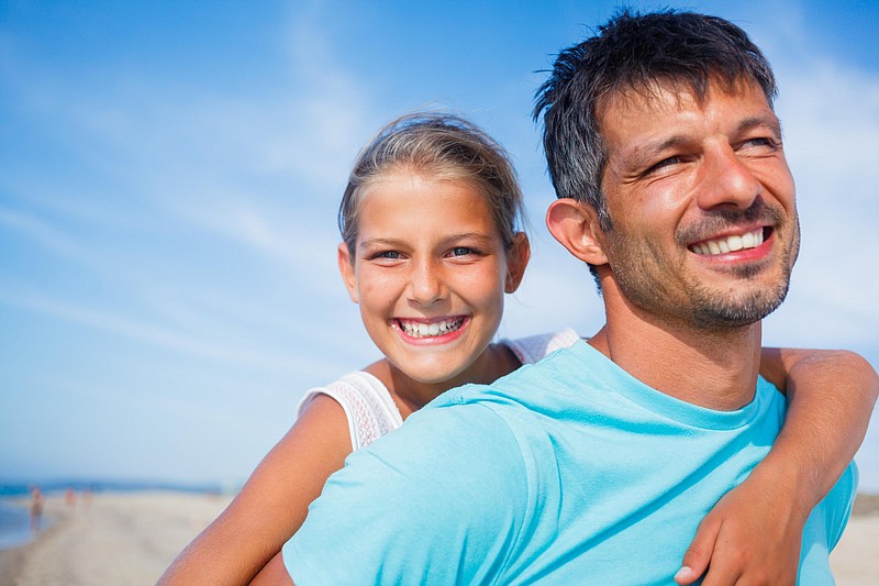 Father and daughter at the beach