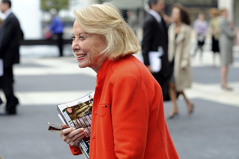 In this Aug. 9, 2009, file photo, Liz Smith leaves the Celebration of Life Memorial ceremony for Walter Cronkite at Avery Fisher Hall in New York. Smith, a gossip columnist whose mixture of banter, barbs, and bon mots about the glitterati helped her climb the A-list as high as many of the celebrities she covered, has died. Literary agent Joni Evans told The Associated Press she died in New York on Sunday, Nov. 12, 2017. She was 94. (AP Photo/Stephen Chernin, File)