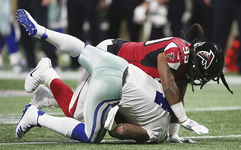 Atlanta Falcons defensive end Adrian Clayborn (99) sacks Dallas Cowboys quarterback Dak Prescott (4) during the second half of an NFL football game, Sunday, Nov. 12, 2017, in Atlanta. (AP Photo/John Bazemore)