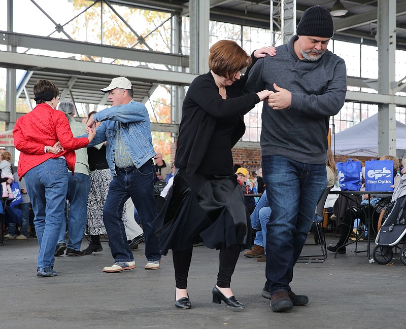 Nancy and Joel Baxley of Signal Mountain, Tenn., dance as Sweet Georgia Sound performs at the Chattanooga Market's Big Band Day at First Tennessee Pavilion Sunday, Nov. 12, 2017, in Chattanooga, Tenn. The Baxleys took about 10 dance lessons 12 years ago and have been dancing ever since. 