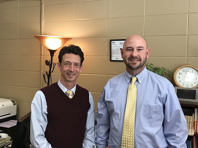 Thrasher Elementary School Principal Jeff Paulson, left, and Nolan Elementary School Principal Shane Harwood come together at Thrasher to discuss the schools' recent recognition as 2017 Reward Schools by the state Department of Education. (Staff photo by Emily Crisman)