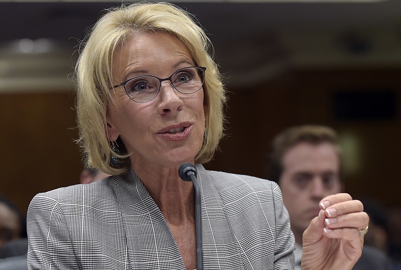 
              FILE - In this June 6, 2017, file photo, Education Secretary Betsy DeVos testifies on Capitol Hill in Washington. Two women who claim they were defrauded by a New York for-profit college are suing the Education Department and a private lender in a case their lawyers hope will offer a new legal remedy for tens of thousands of students frustrated with the agency's inaction on loan forgiveness claims. (AP Photo/Susan Walsh, File)
            