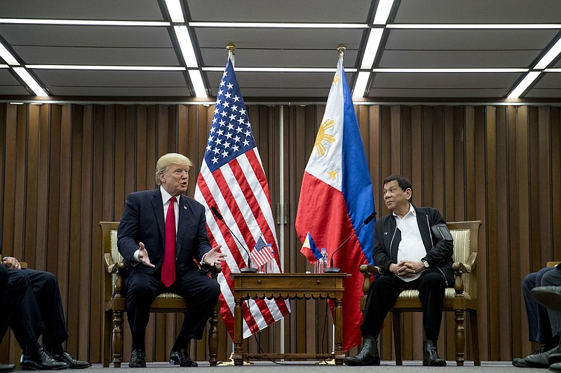 U.S. President Donald Trump, left, accompanied by Philippines President Rodrigo Duterte speaks during a bilateral meeting at the ASEAN Summit at the Philippine International Convention Center, Monday, Nov. 13, 2017, in Manila, Philippines. (AP Photo/Andrew Harnik)
