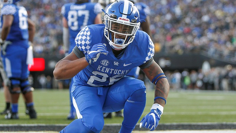 Sophomore Benny Snell, shown here celebrating one of his three touchdowns last Saturday at Vanderbilt, is the first running back in Kentucky history with consecutive 1,000-yard seasons.