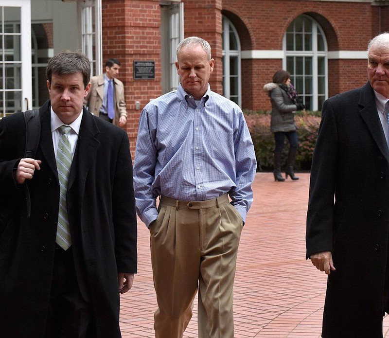 Former Pilot Flying J Vice President of Sales John Freeman, center, leaves federal court after being arraigned on charges including conspiracy to commit wire fraud and mail fraud. Freeman pleaded guilty earlier this year. (Photo: Michael Patrick / News Sentinel)