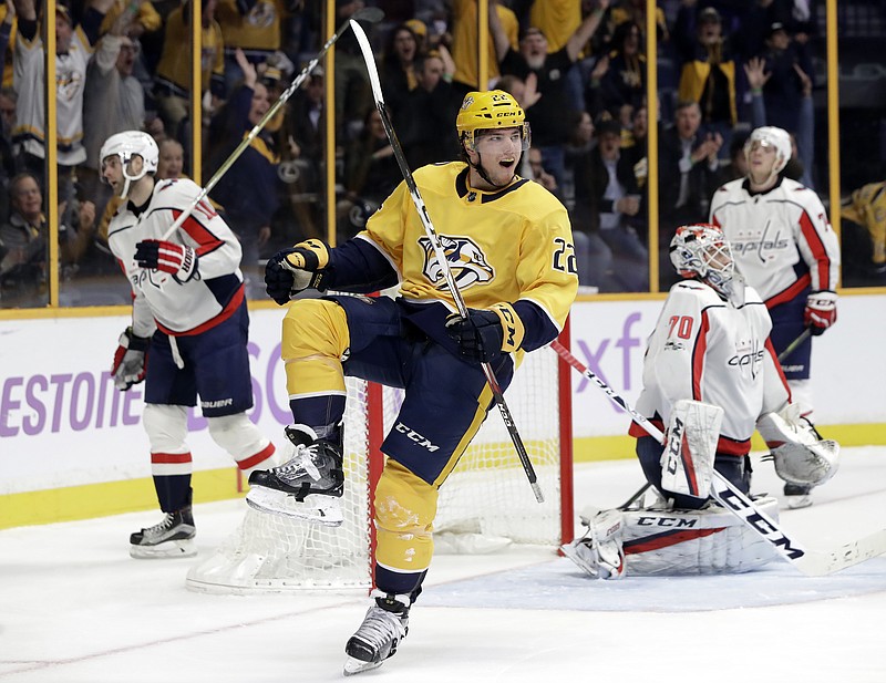 Nashville Predators left wing Kevin Fiala (22), of Switzerland, celebrates after scoring a goal against Washington Capitals goalie Braden Holtby (70) in the second period of an NHL hockey game, Tuesday, Nov. 14, 2017, in Nashville, Tenn. (AP Photo/Mark Humphrey)